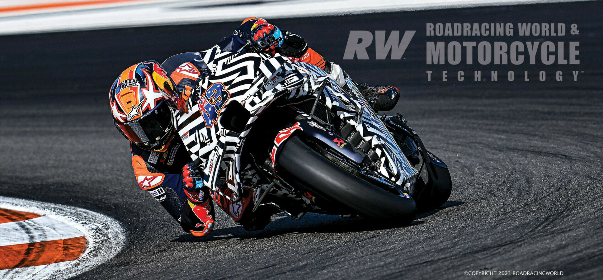 Jack Miller on a KTM RC16 with a carbon-fiber frame and camouflaged bodywork hiding experimental ground-effect aerodynamic devices on the upper fairing, in post-season testgin at Valencia. Photo by Gigi Soldano/DPPI Media.