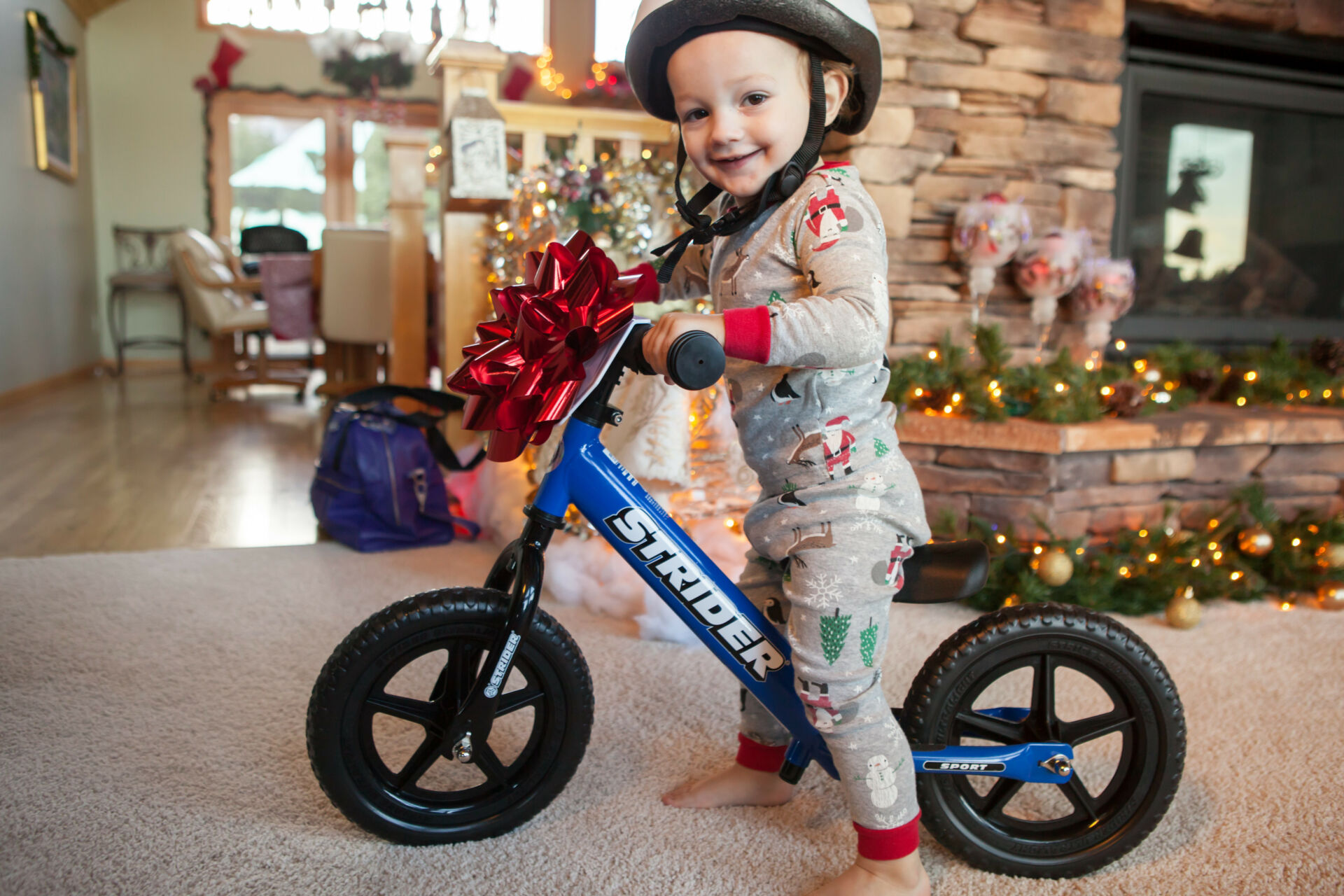 A future rider with a Strider 12 Sport balance bike. Photo courtesy Strider Bikes.